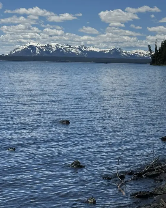 Snow-capped peaks across a wide blue lake